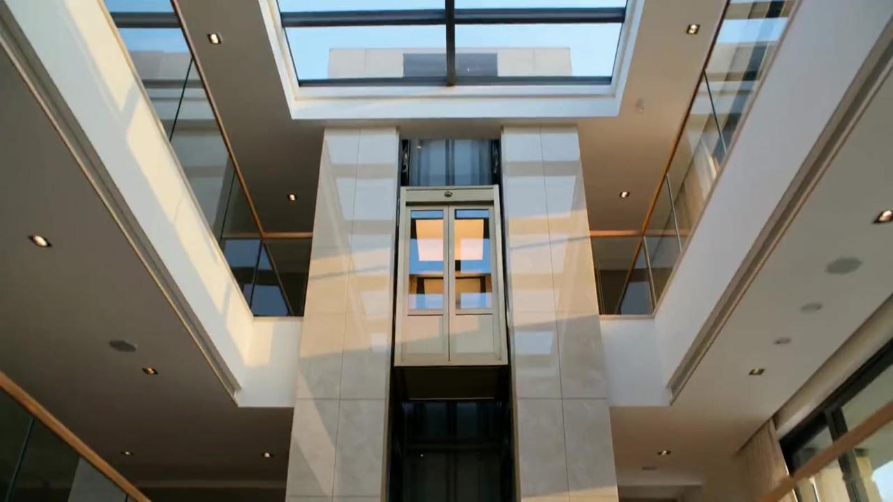 Bronze villa elevator in a bright, modern living space